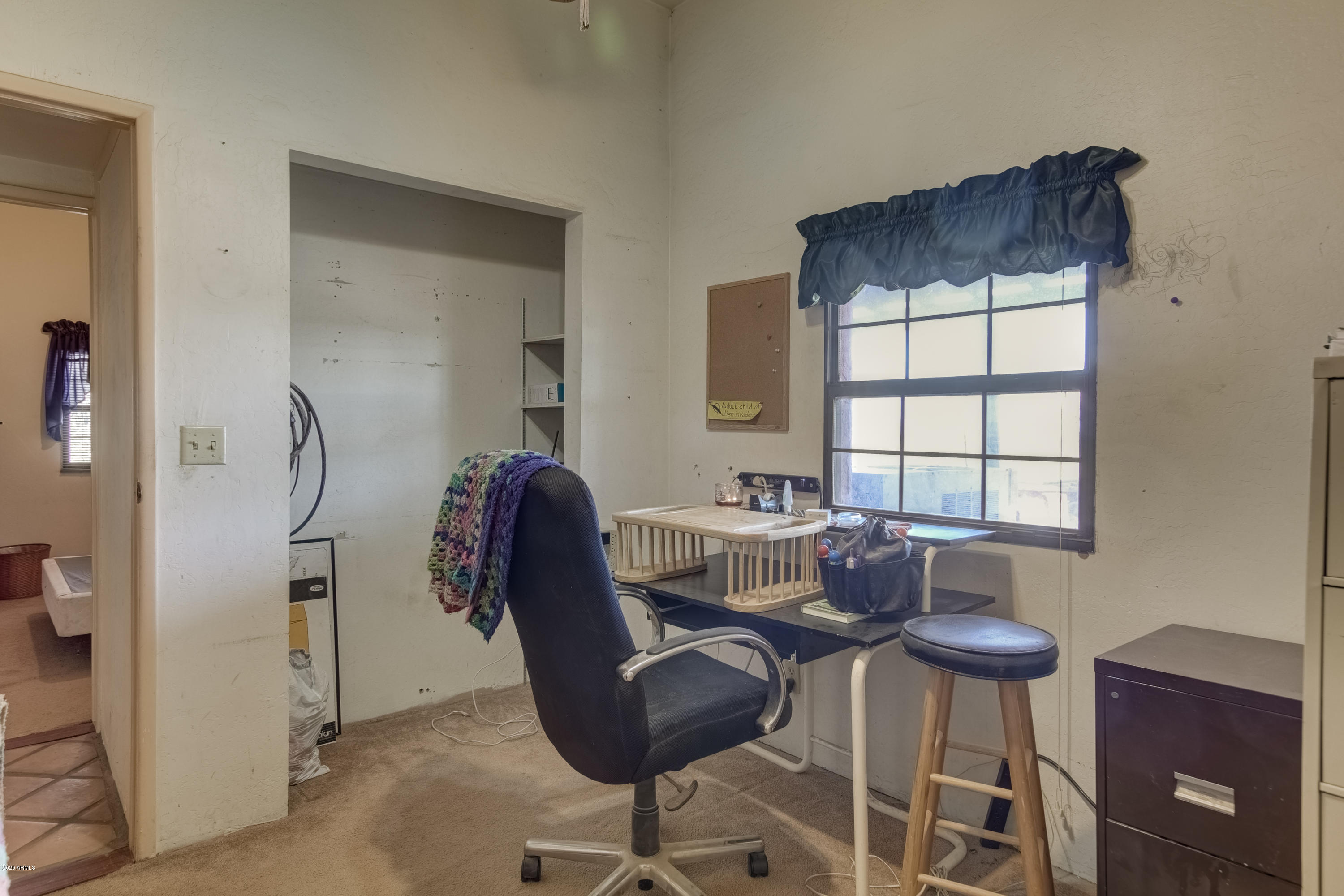 667 South Opal Road Maricopa, AZ 85139 - Photo 22 of 42 a workspace with furniture and a window