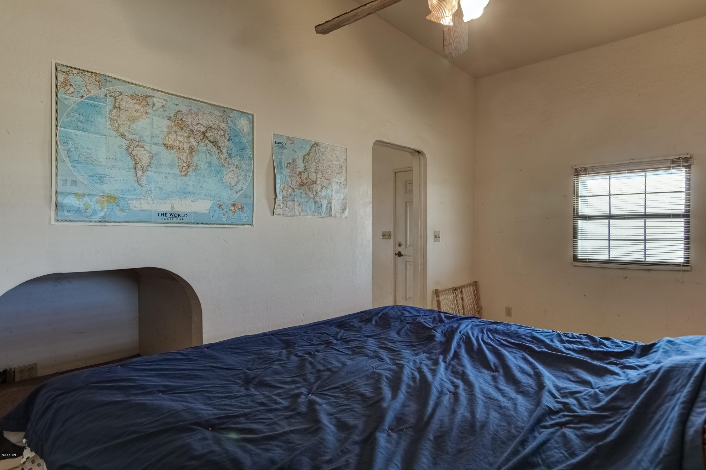 667 South Opal Road Maricopa, AZ 85139 - Photo 27 of 42 a bedroom with a bed and a painting on the wall
