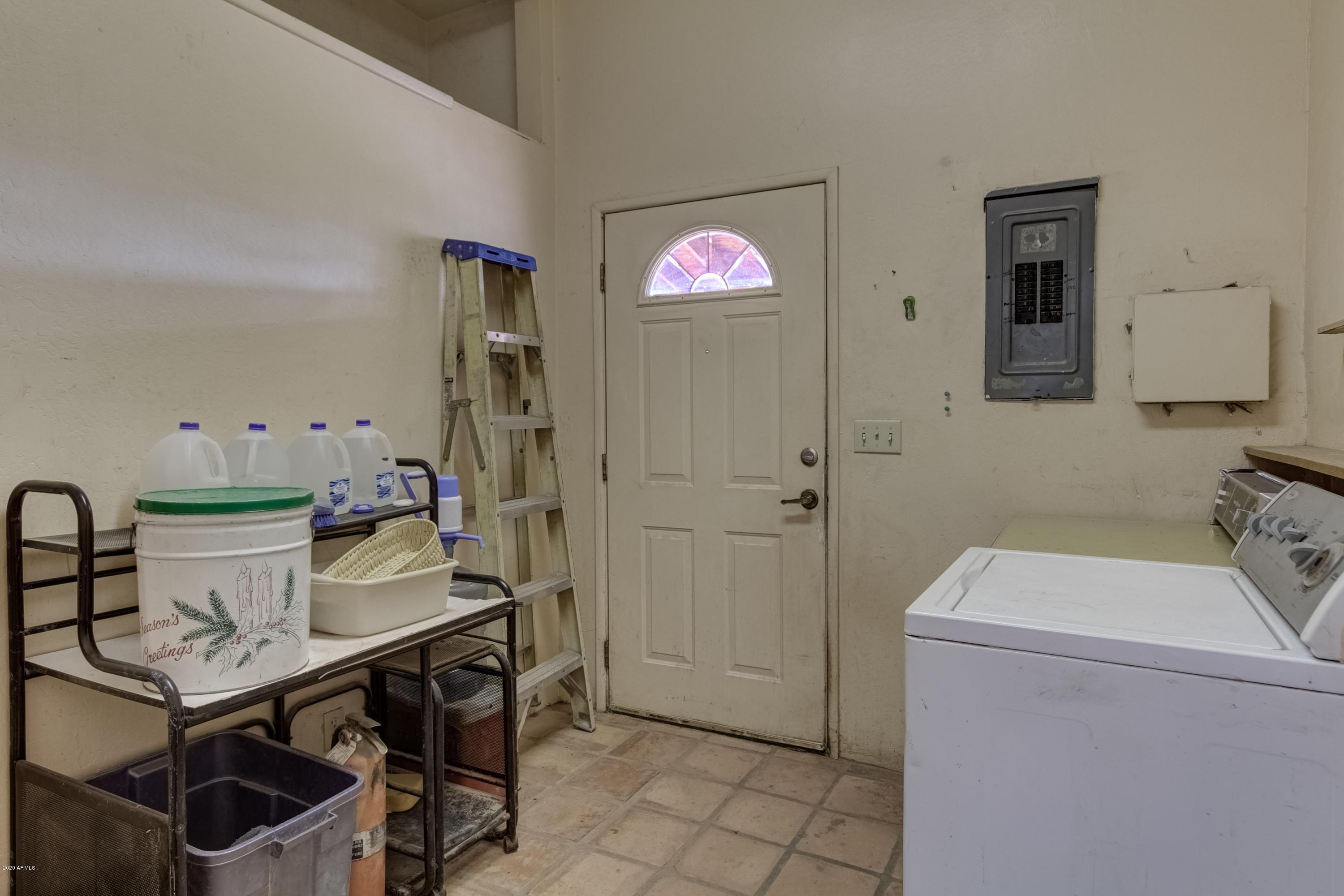 667 South Opal Road Maricopa, AZ 85139 - Photo 28 of 42 a view of kitchen filled with furniture and washer