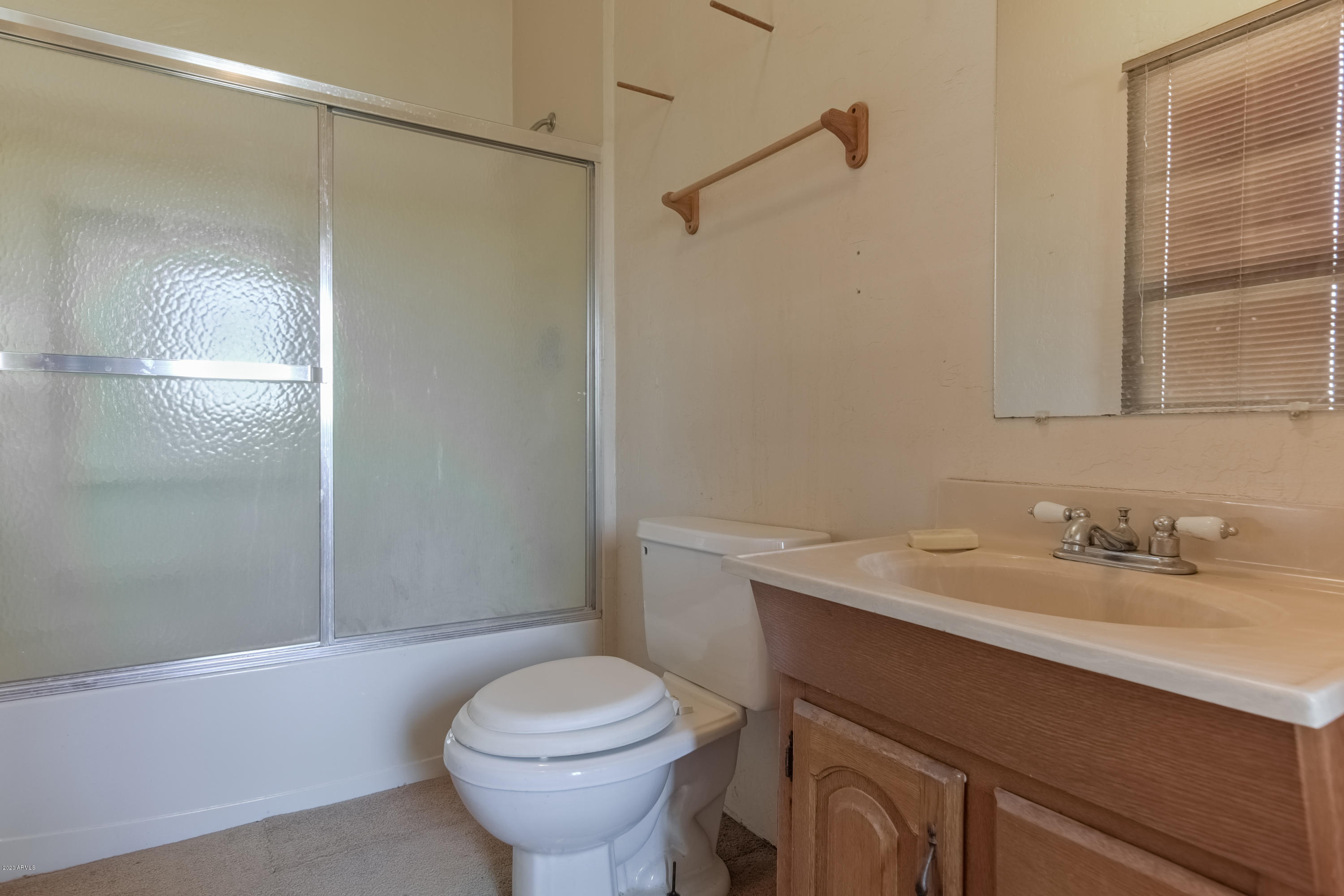 667 South Opal Road Maricopa, AZ 85139 - Photo 30 of 42 a bathroom with a sink toilet and shower