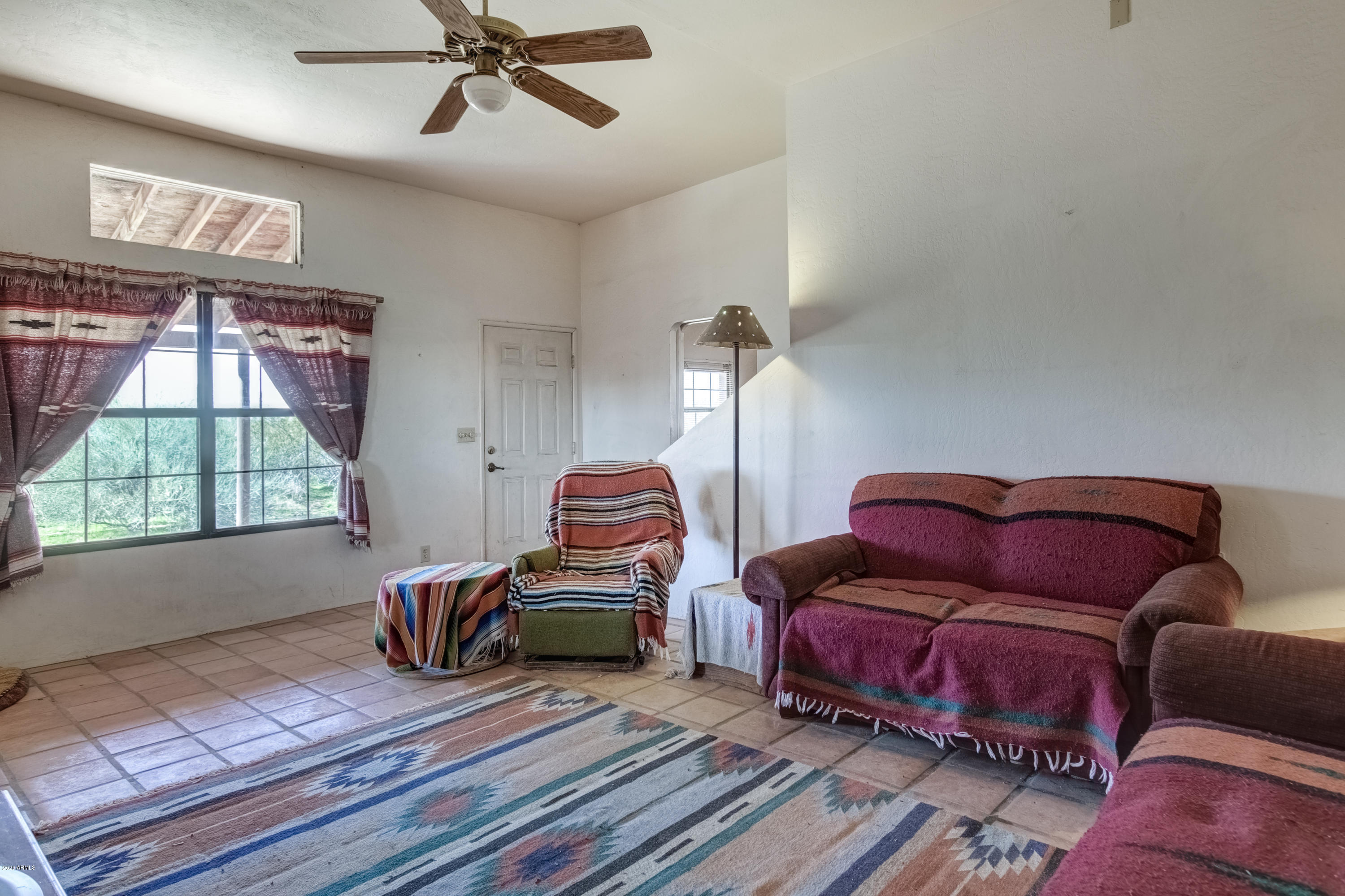 667 South Opal Road Maricopa, AZ 85139 - Photo 3 of 42 a living room with furniture and a window