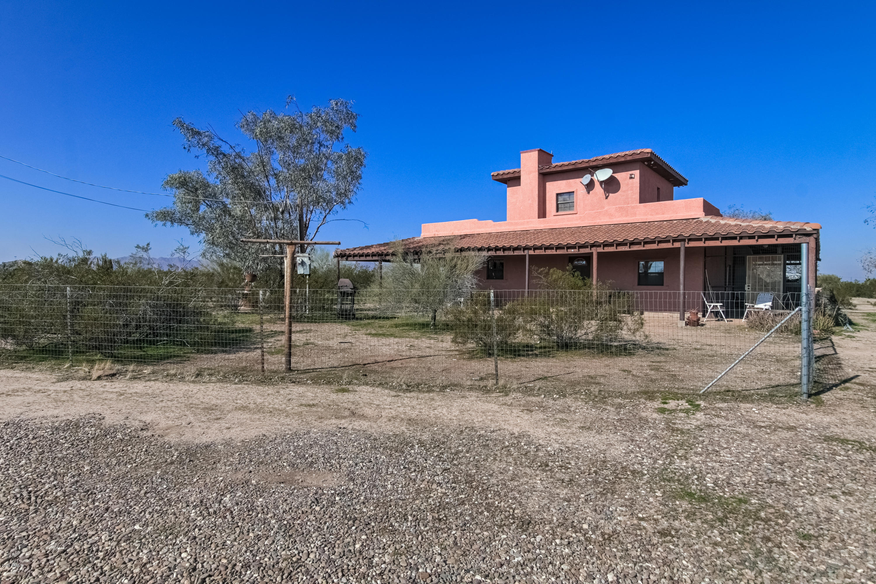 667 South Opal Road Maricopa, AZ 85139 - Photo 35 of 42 a front view of a house with a yard