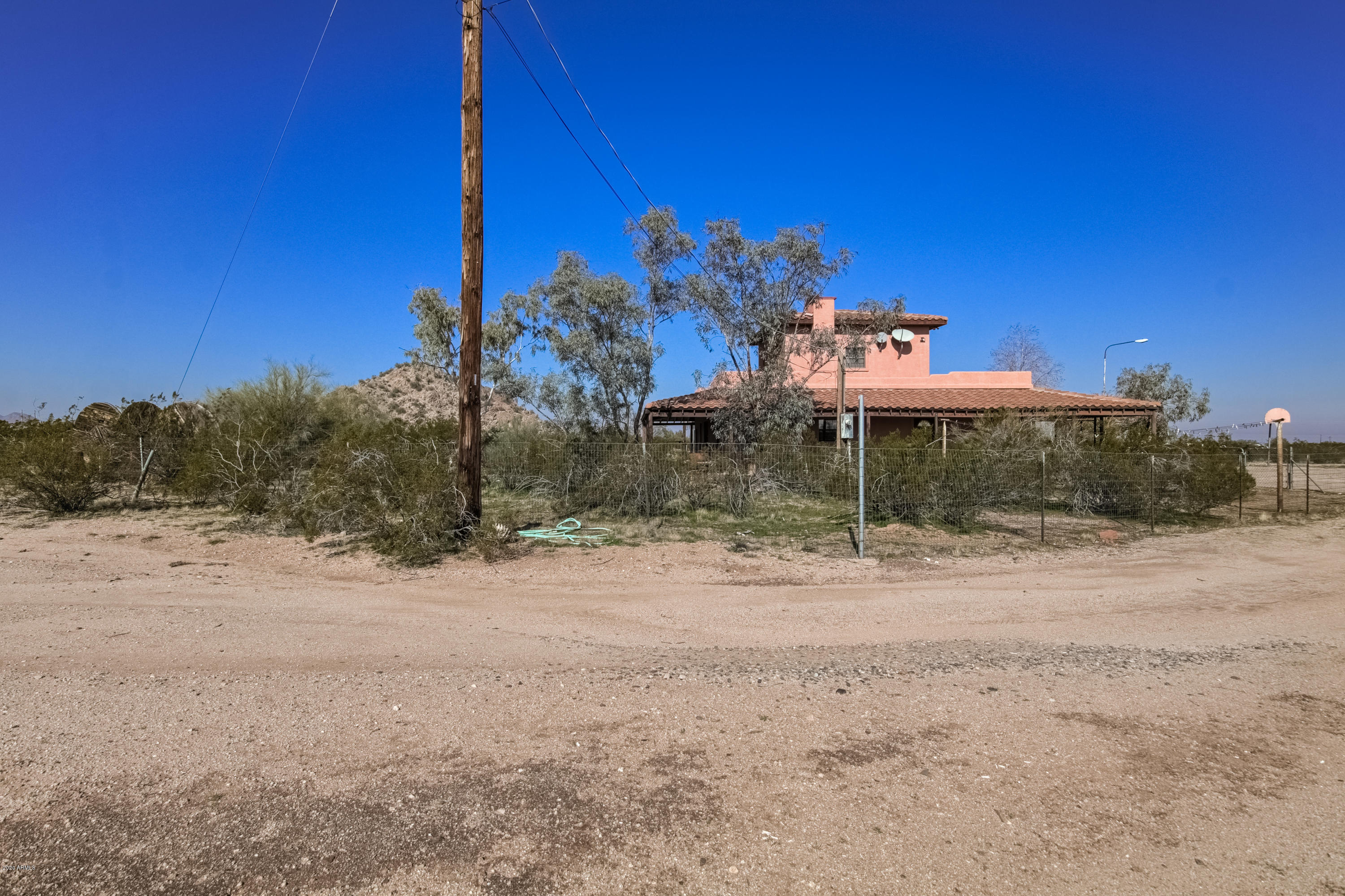 667 South Opal Road Maricopa, AZ 85139 - Photo 36 of 42 a view of a road with a building in the background