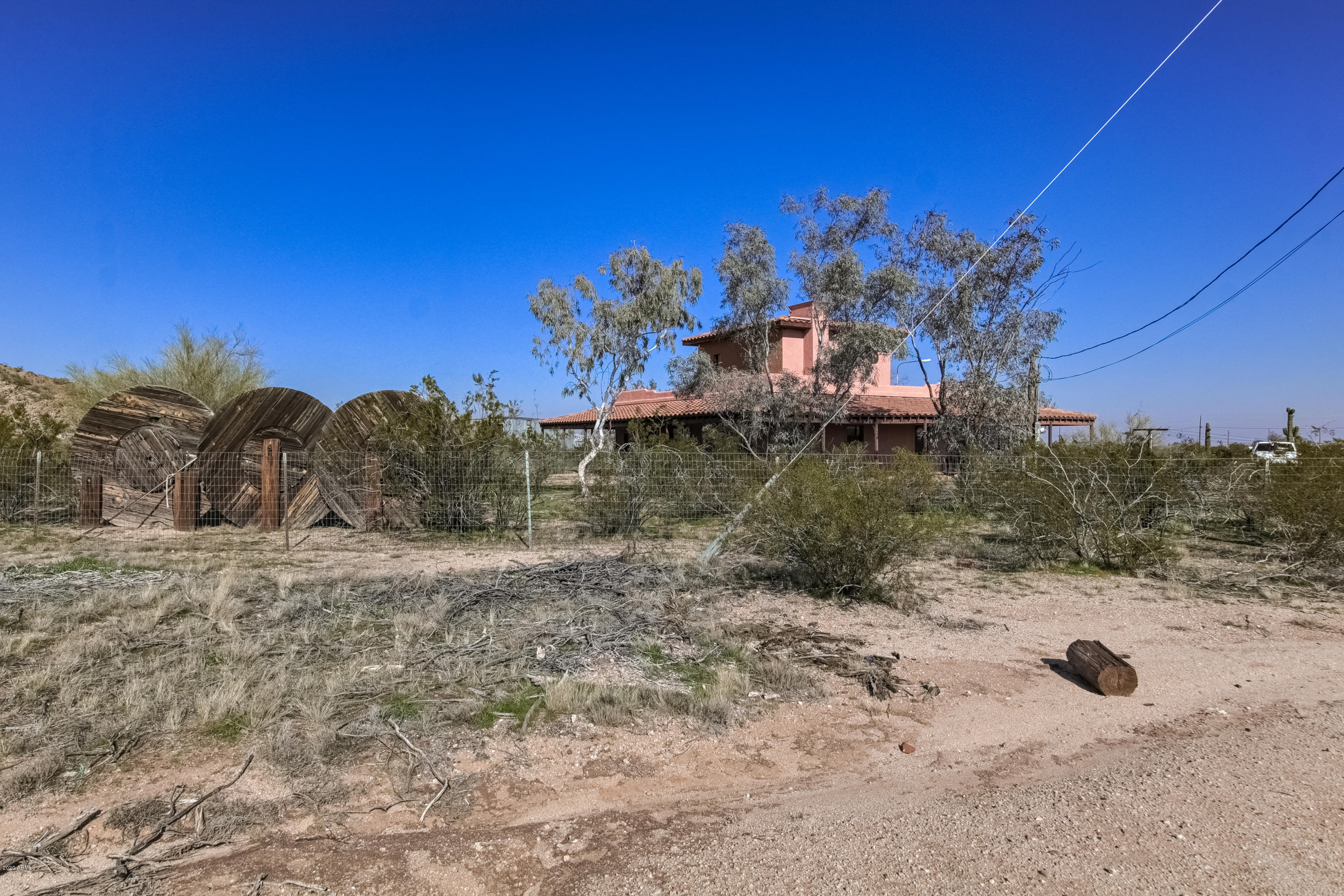 667 South Opal Road Maricopa, AZ 85139 - Photo 37 of 42 a view of a dry yard with a tree
