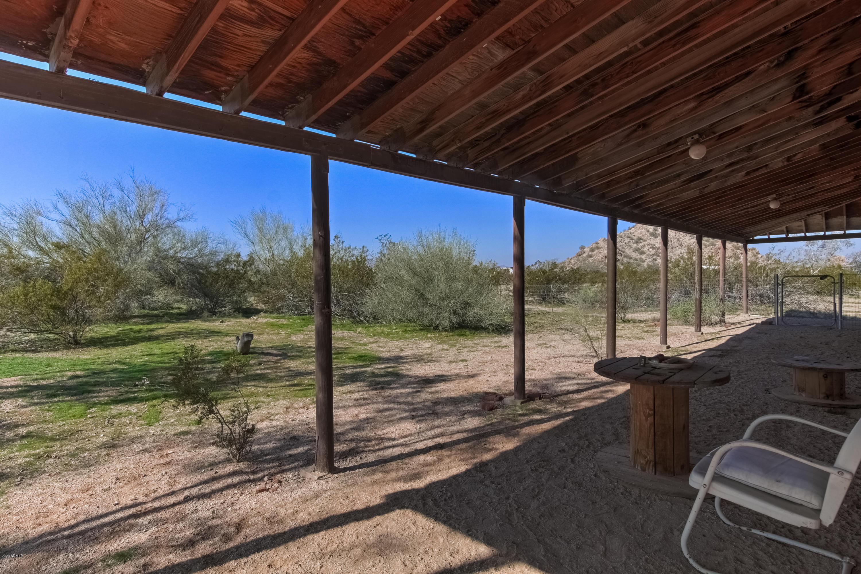 667 South Opal Road Maricopa, AZ 85139 - Photo 41 of 42 a view of a porch with a yard
