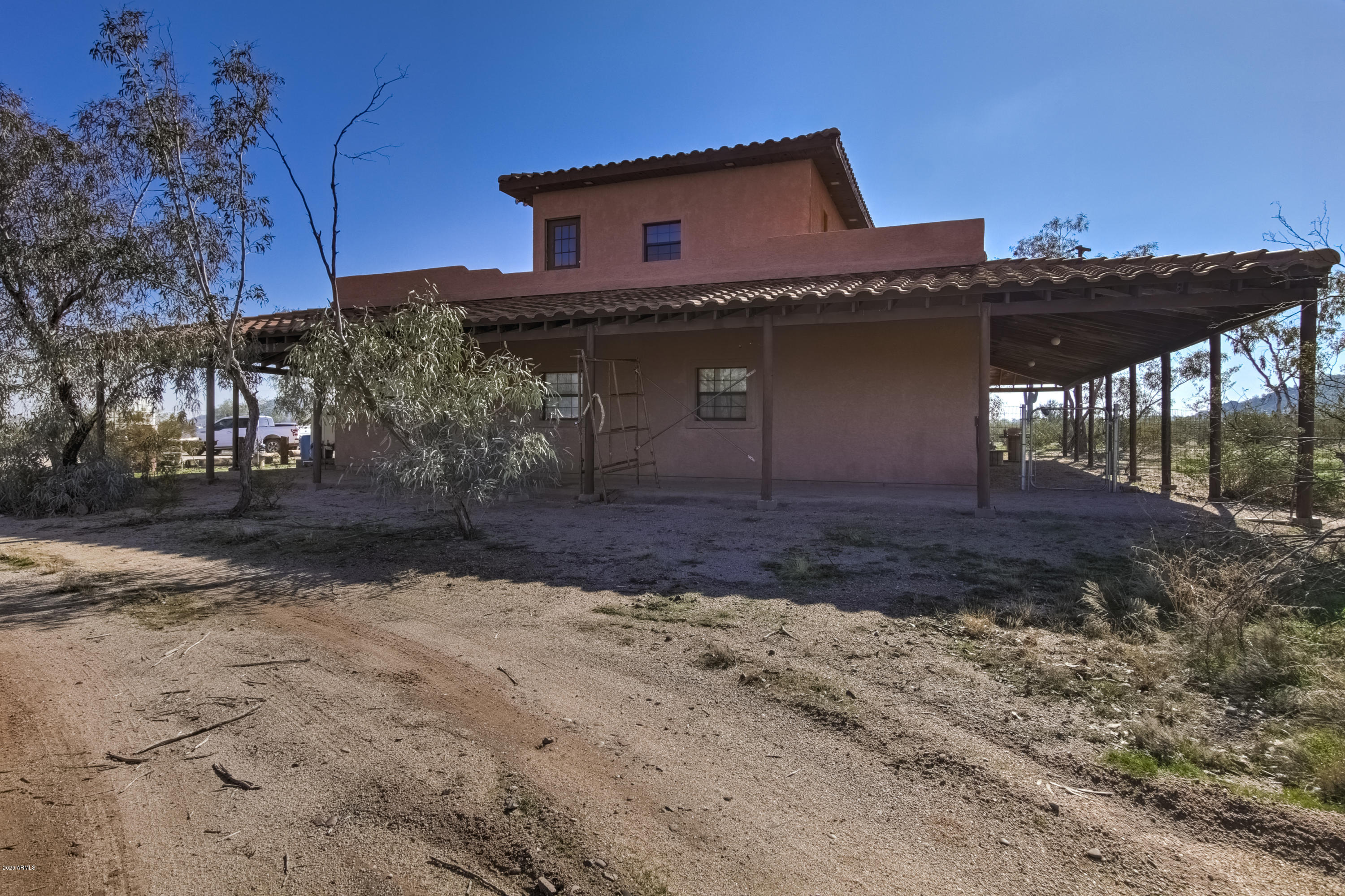 667 South Opal Road Maricopa, AZ 85139 - Photo 9 of 42 a front view of a house with a yard