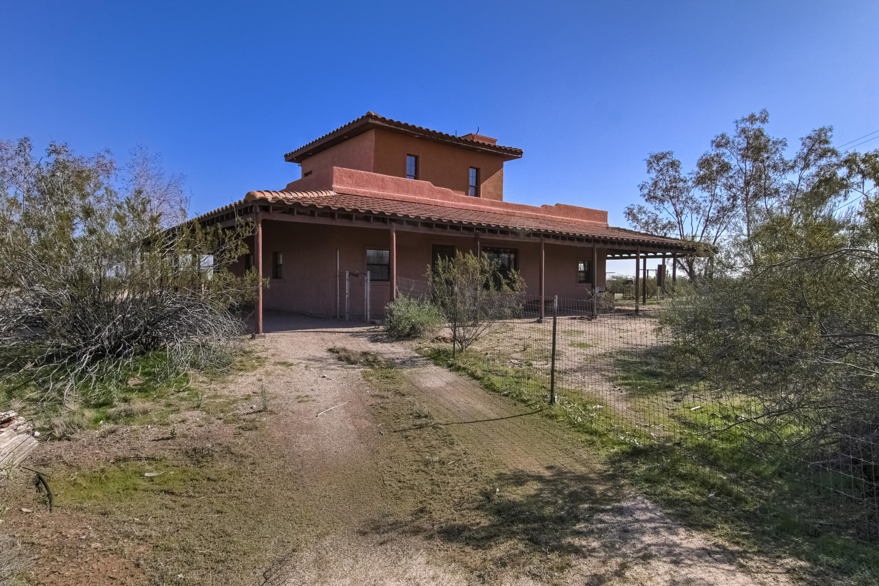 667 South Opal Road Maricopa, AZ 85139 - Photo 10 of 42 a front view of a house with a yard