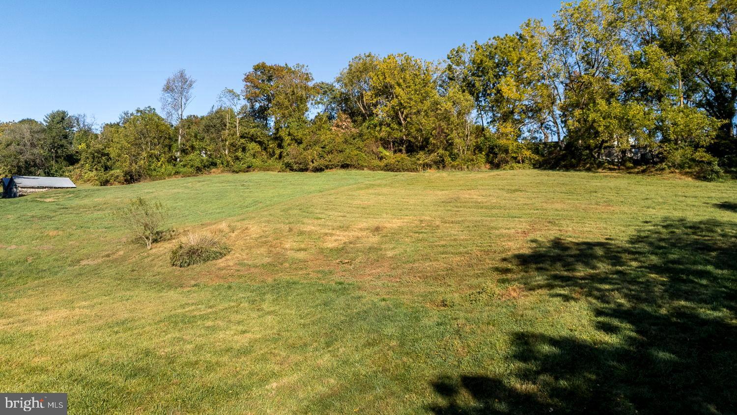 187 East Hillendale Road Kennett Square, PA 19348 - Photo 3 of 11 Lush green landscape under a clear blue sky.
