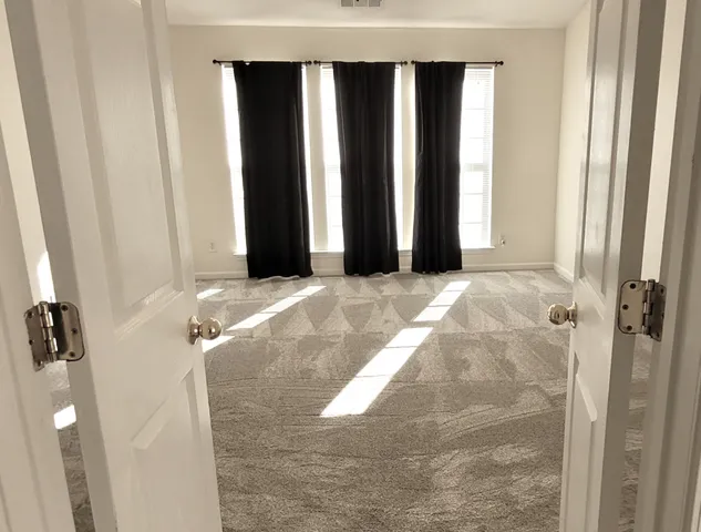 a bathroom with a glass shower door