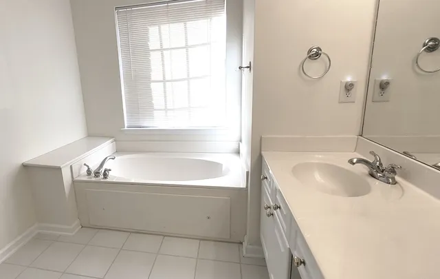 a bathroom with a shower and vanity