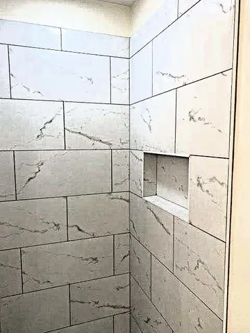 a bathroom with a toilet a sink and a bathtub