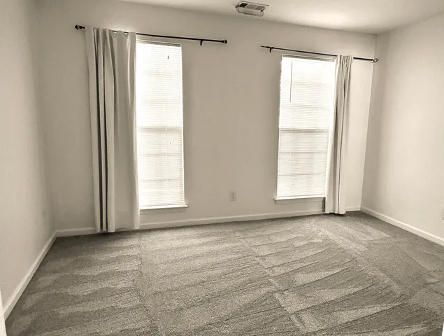 a white toilet sitting next to a bath tub