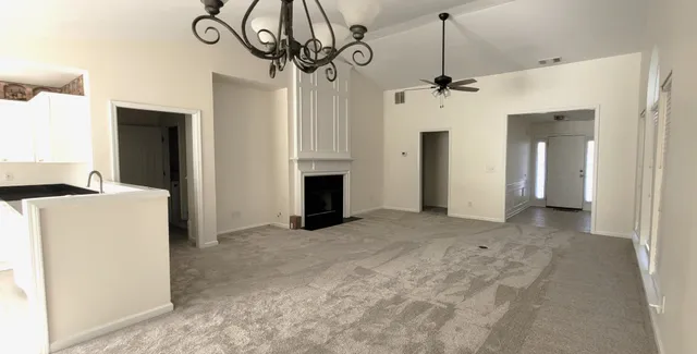 a view of a hallway with a chandelier