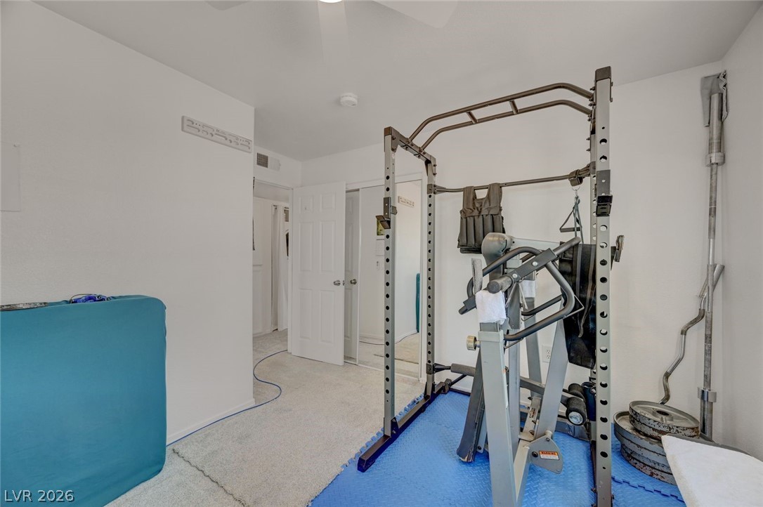 3318 North Decatur Boulevard, Unit 2072 Las Vegas, NV 89130 - Photo 25 of 50 An adaptable space for fitness activities, featuring soft carpeting and a clear pathway.