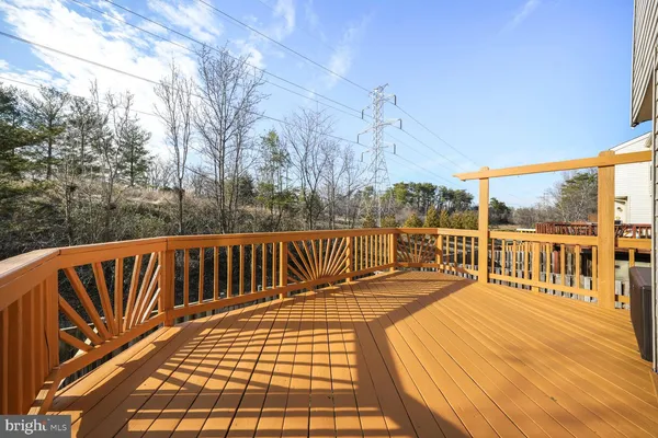 a view of balcony with wooden floor
