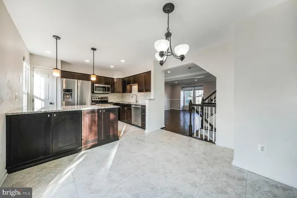 a view of a kitchen with a chandelier