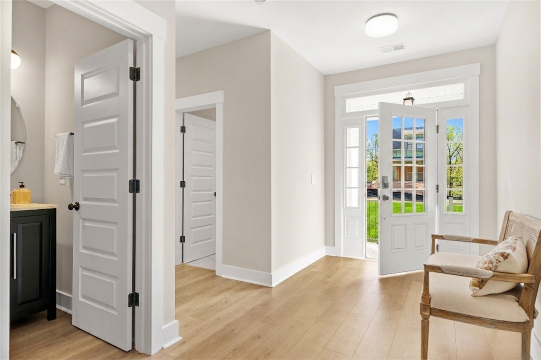334 Summerall Drive Anderson, SC 29621 - Photo 14 of 28 This bright entryway features a modern front door and light wood flooring.