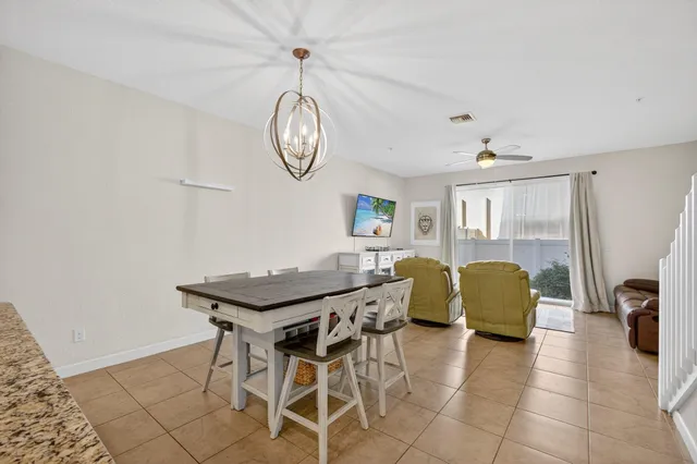 a kitchen with stainless steel appliances granite countertop a sink refrigerator and cabinets
