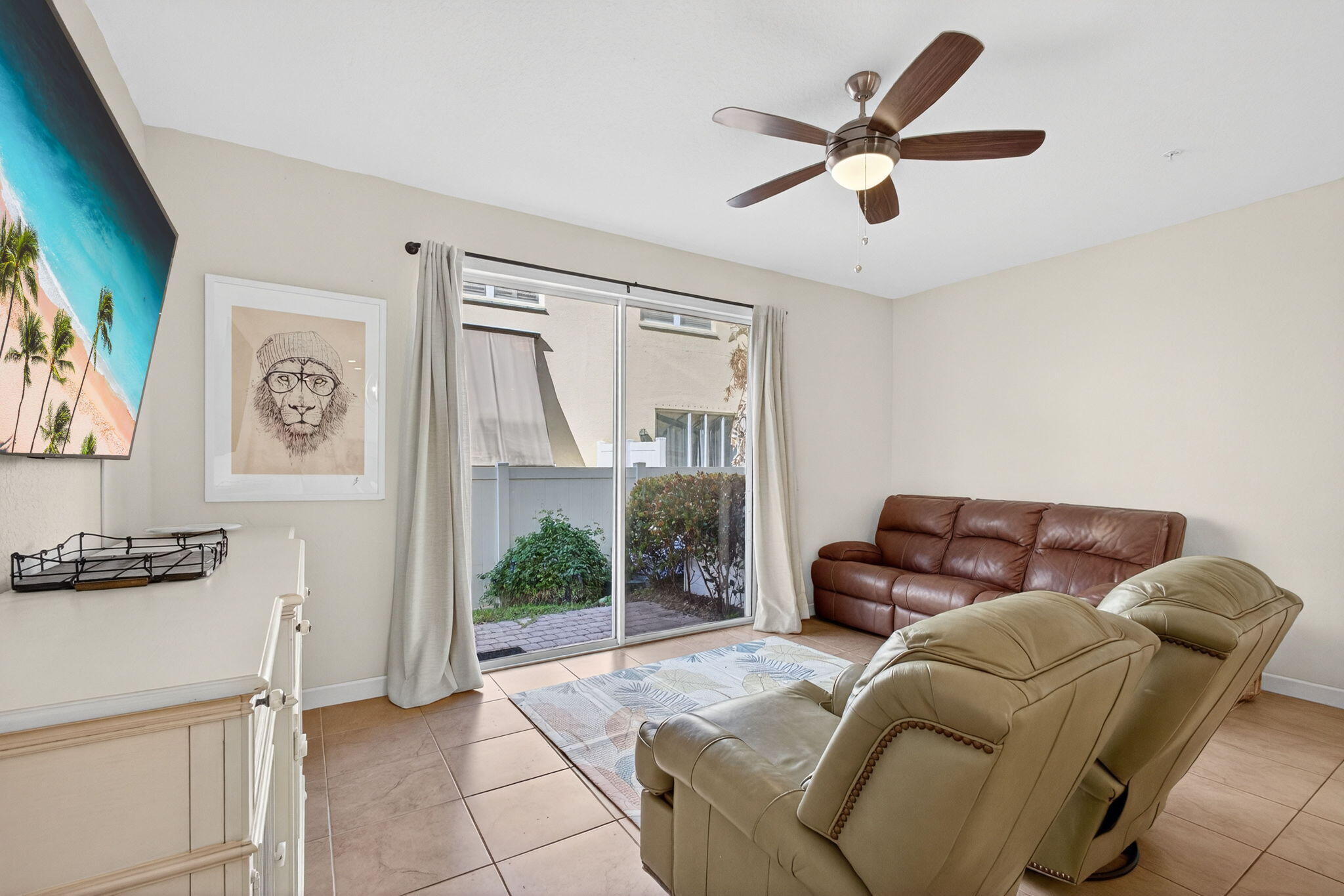 9440 Southwest Merlin Court Stuart, FL 34997 - Photo 16 of 54 a living room with furniture and a window