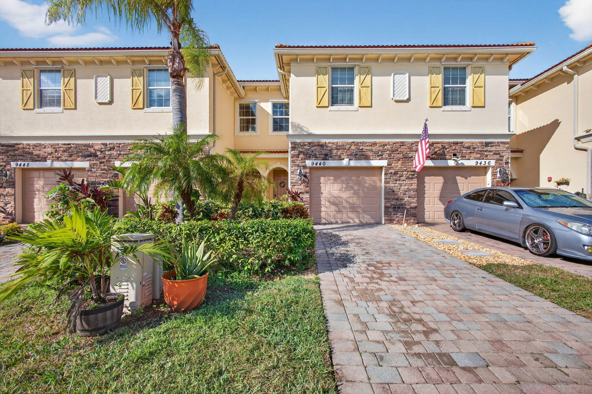 9440 Southwest Merlin Court Stuart, FL 34997 - Photo 2 of 54 a view of a house with a garden