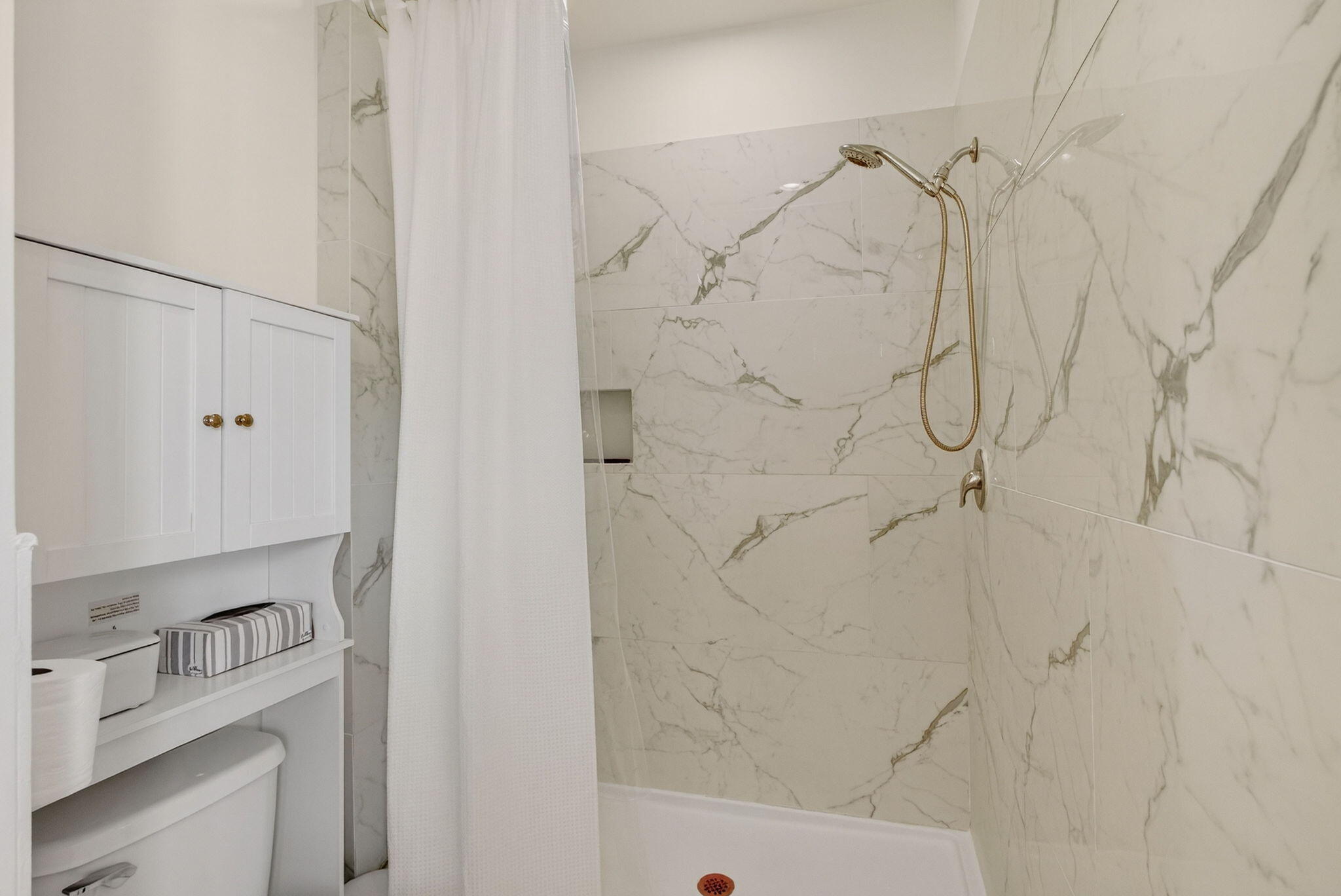 9440 Southwest Merlin Court Stuart, FL 34997 - Photo 28 of 54 a bathroom with a bathtub and shower