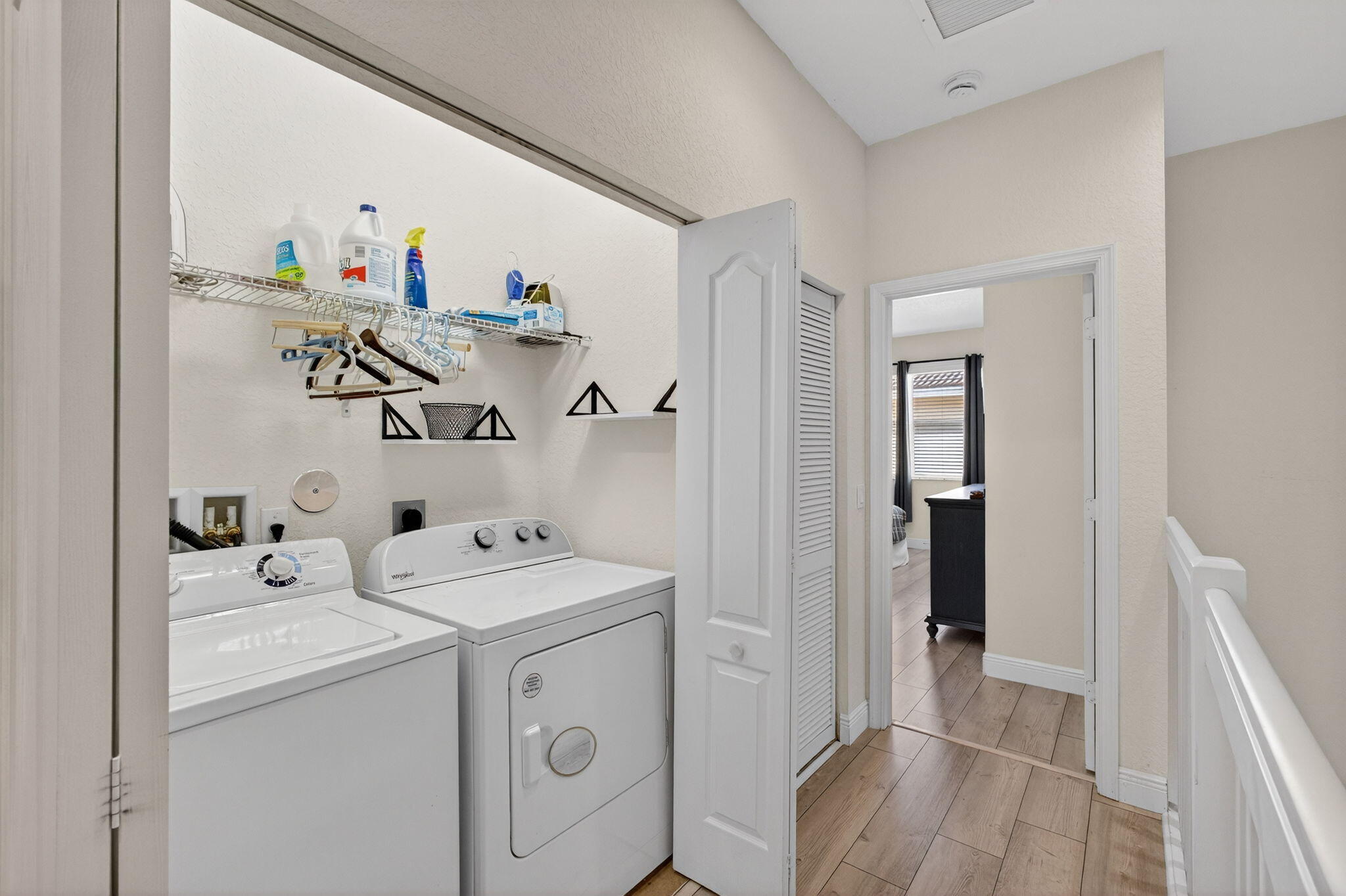 9440 Southwest Merlin Court Stuart, FL 34997 - Photo 33 of 54 a utility room with dryer and washer