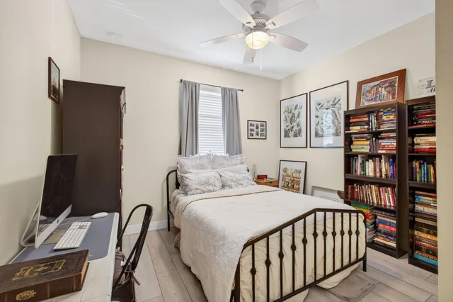 a bathroom with a double vanity sink toilet and a mirror