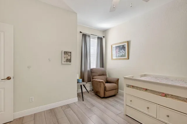 an aerial view of multiple houses with a yard