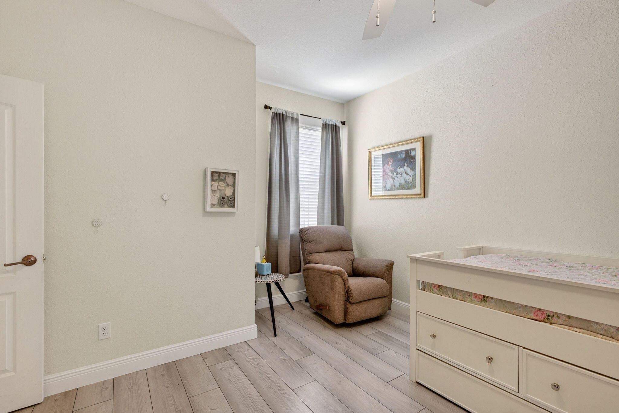 9440 Southwest Merlin Court Stuart, FL 34997 - Photo 39 of 54 a living room with furniture and a wooden floor