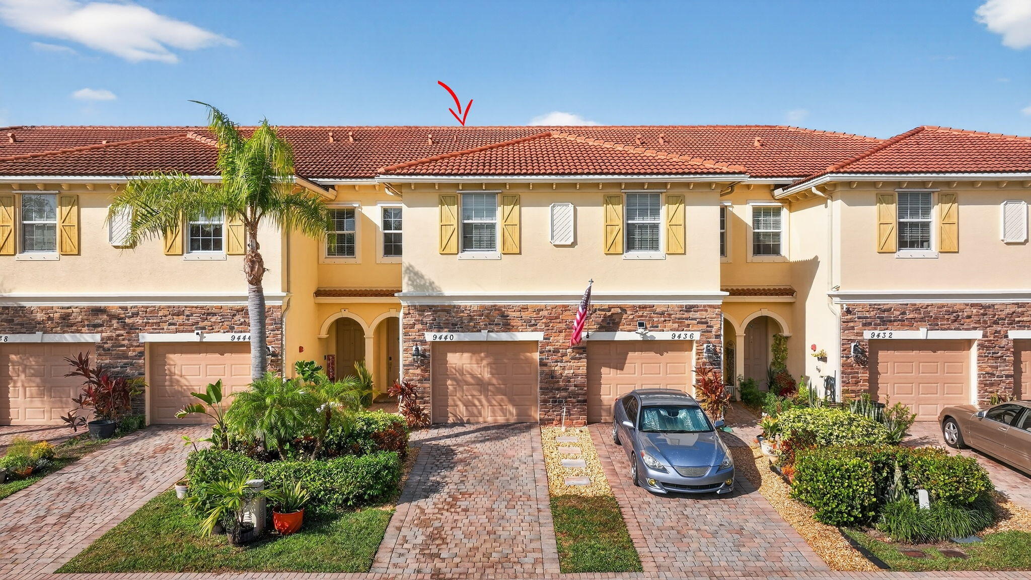 9440 Southwest Merlin Court Stuart, FL 34997 - Photo 42 of 54 a front view of a house with a yard