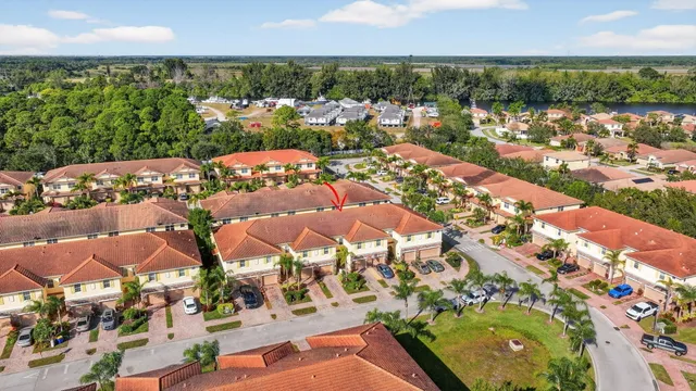 an aerial view of a house with a yard and a garden