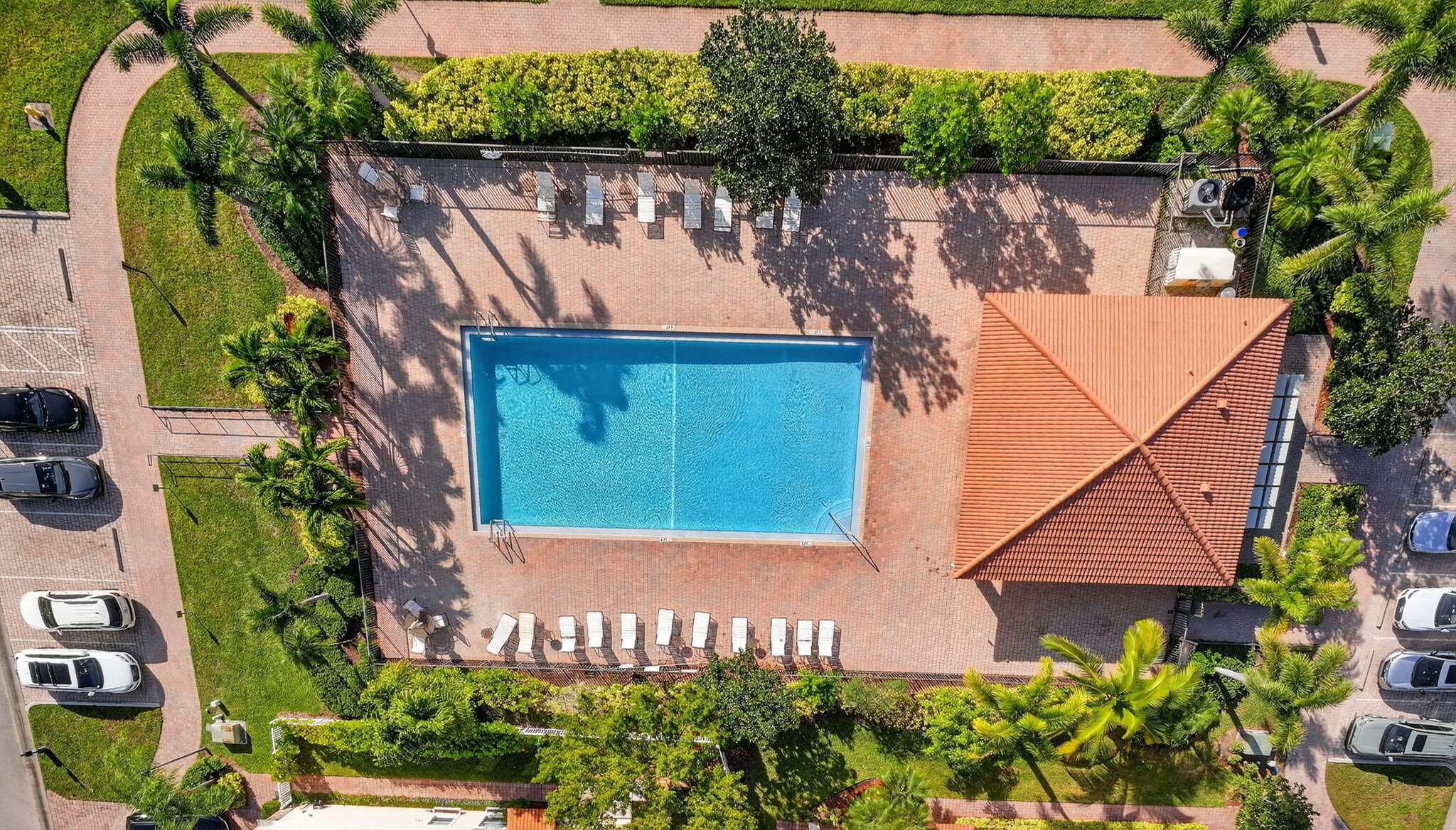 9440 Southwest Merlin Court Stuart, FL 34997 - Photo 48 of 54 an aerial view of a house with a yard and a garden