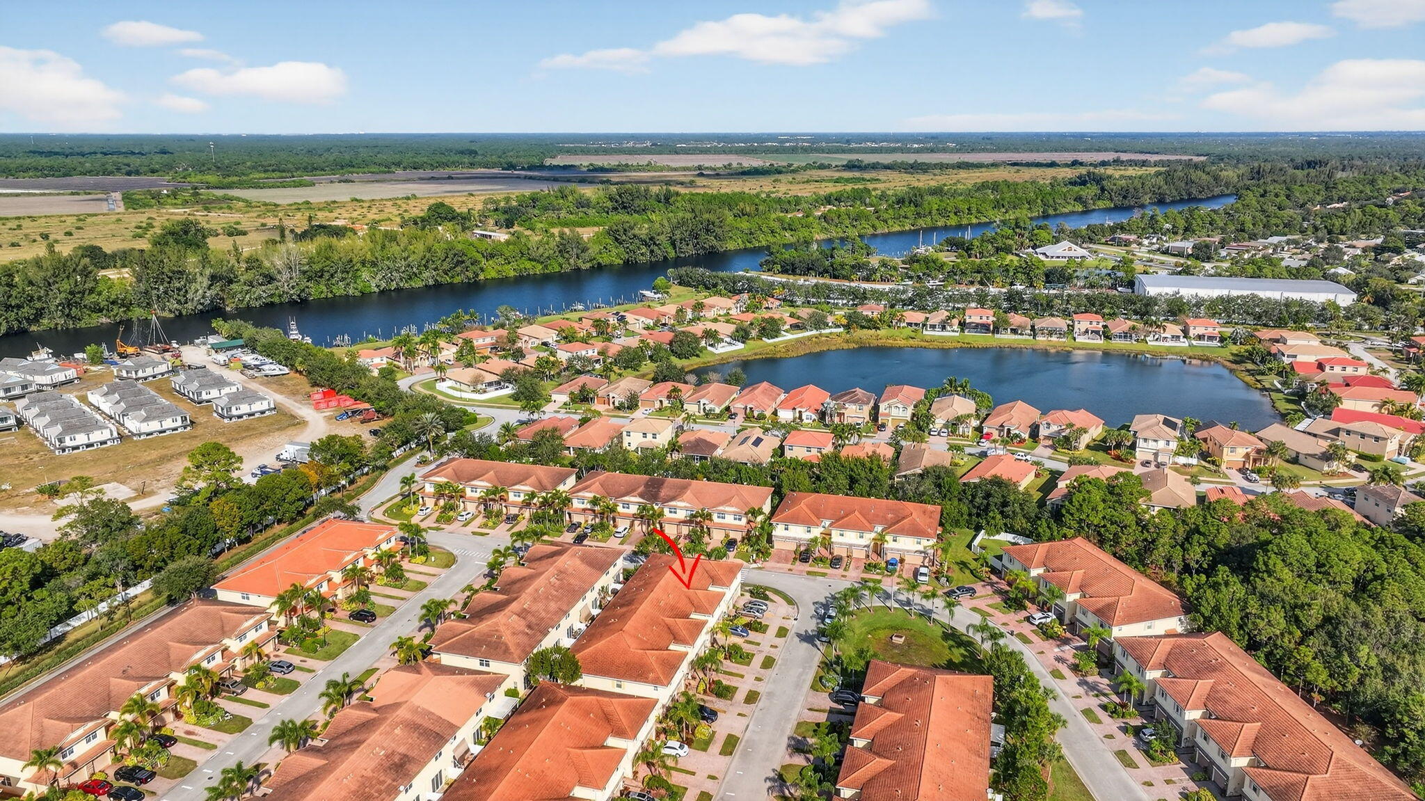 9440 Southwest Merlin Court Stuart, FL 34997 - Photo 49 of 54 an aerial view of ocean and residential houses with outdoor space