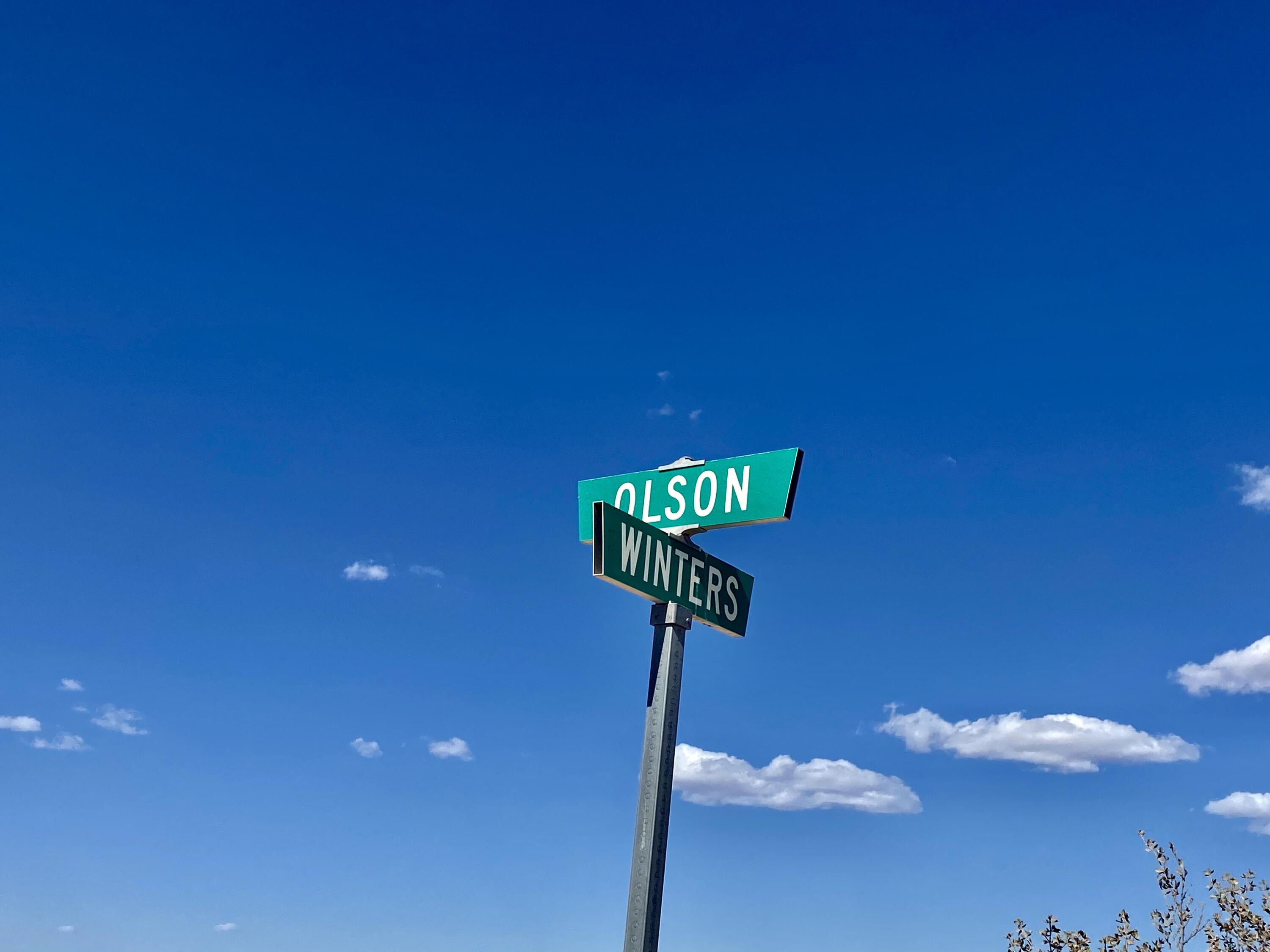 124 Winters Road Joshua Tree, CA 92252 - Photo 22 of 25 a street sign sitting on top of a wall