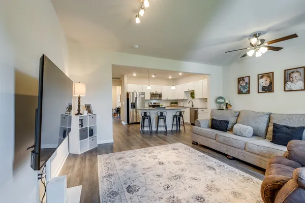a living room with furniture and a flat screen tv