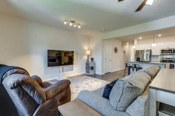 a living room with furniture and a flat screen tv