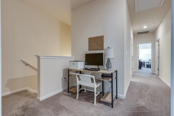 a view of a workspace with furniture