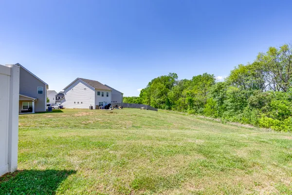 a view of a house with a big yard