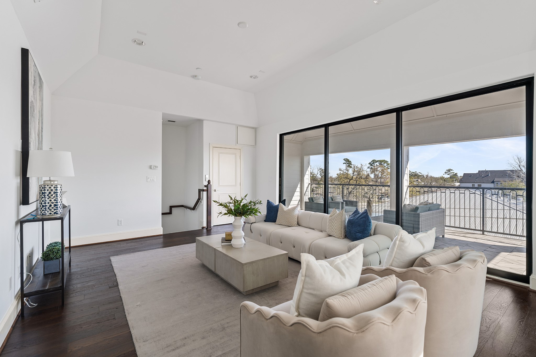 1314 Hunters Meadow Lane Houston, TX 77055 - Photo 2 of 37 The inviting flex/game room features high ceilings and large glass doors leading to an incredible balcony, offering plenty of natural light.