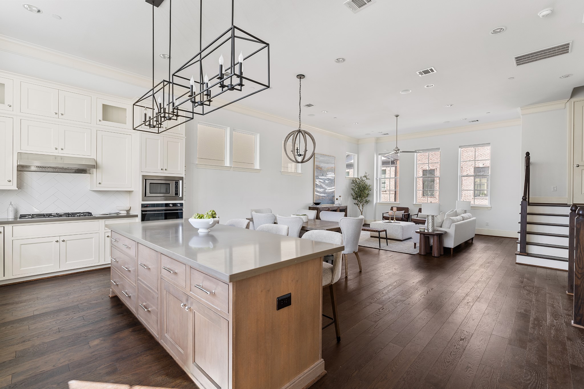 1314 Hunters Meadow Lane Houston, TX 77055 - Photo 5 of 37 The heart of the home is the spacious island with quartz counters. Unique chandeliers in both the kitchen and dining rooms give the space elegance and an inviting warmth