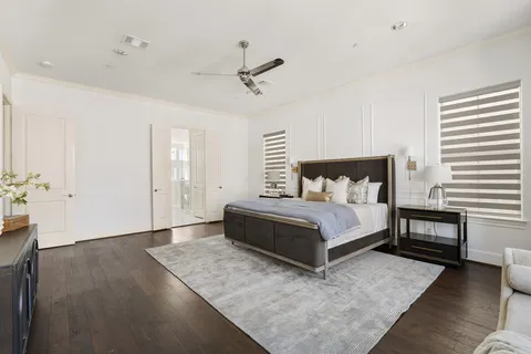an empty room with wooden floor and white walls