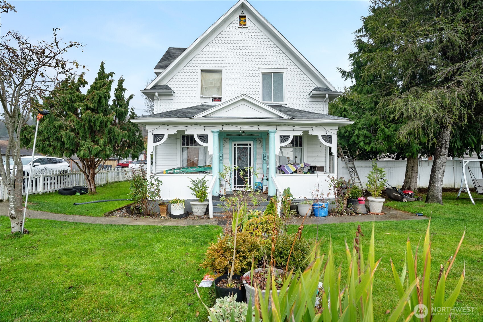 a front view of a house with a yard table and chairs