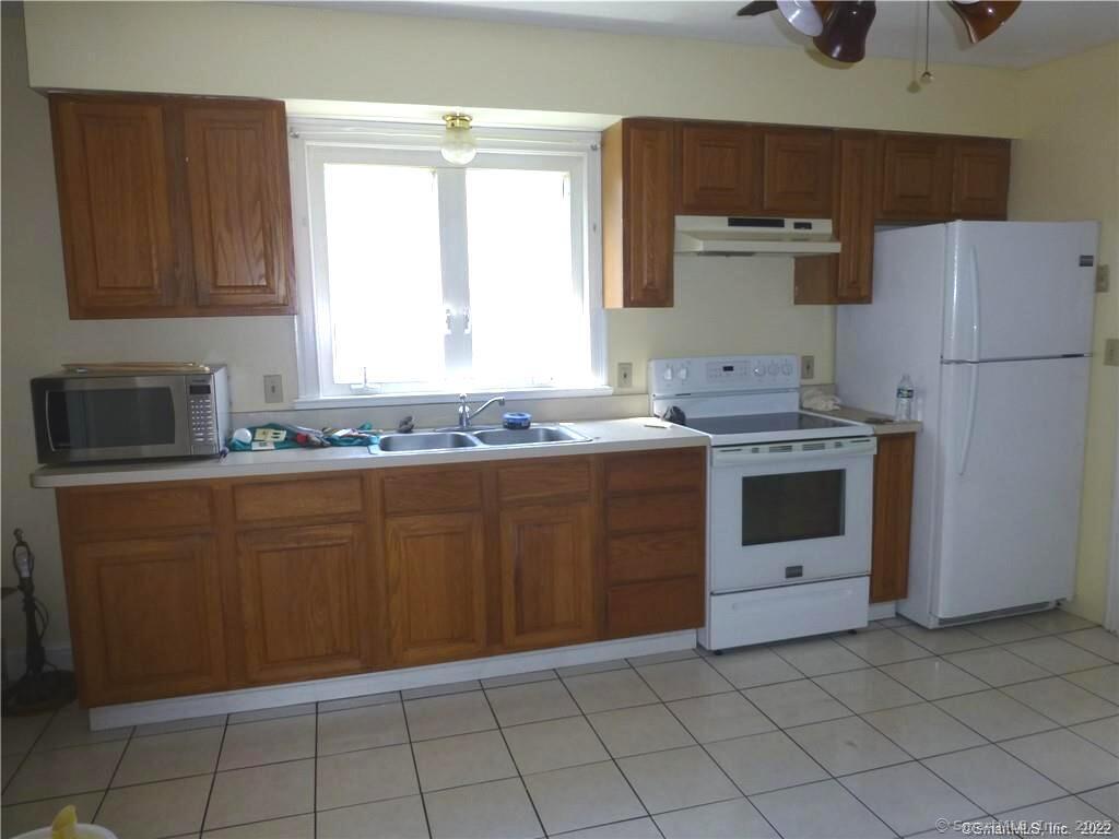 73 William Street, Unit 2 Wallingford, CT 06492 - Photo 4 of 15 Kitchen w/tile floor