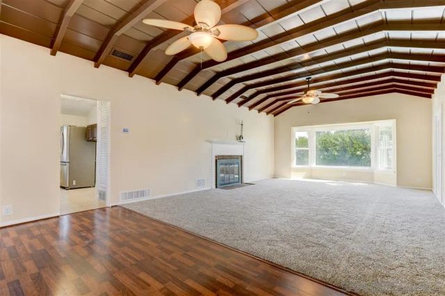 a view of a empty room with a roof