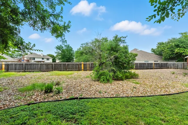 a view of backyard with green space