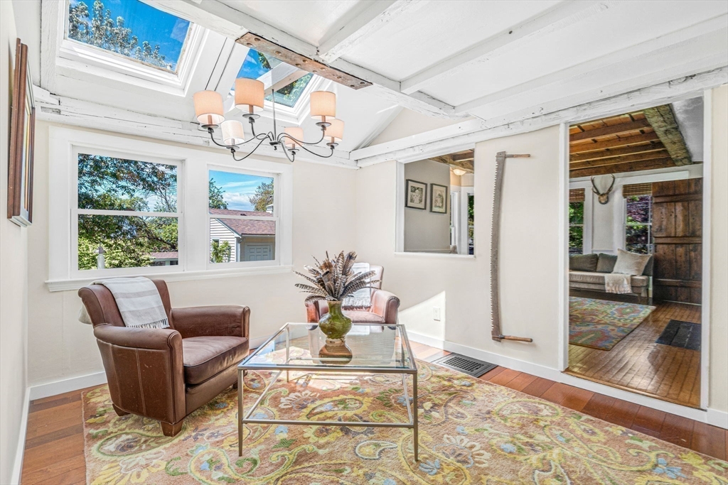 34 Everett Street Natick, MA 01760 - Photo 15 of 34 a living room with patio furniture and a floor to ceiling window