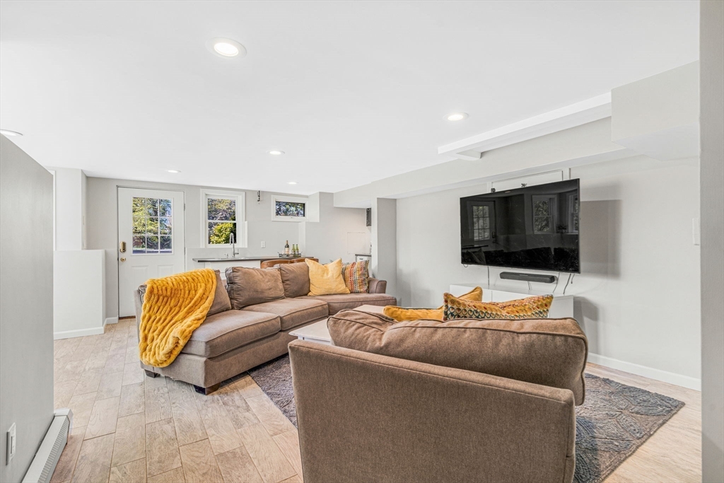 34 Everett Street Natick, MA 01760 - Photo 23 of 34 a living room with furniture and a flat screen tv
