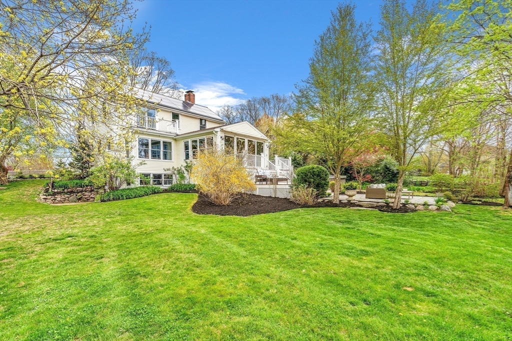 34 Everett Street Natick, MA 01760 - Photo 27 of 34 a view of a house with a big yard and sitting area