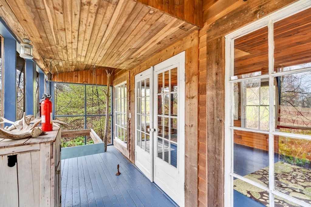 34 Everett Street Natick, MA 01760 - Photo 28 of 34 a view of a porch with a table and chairs