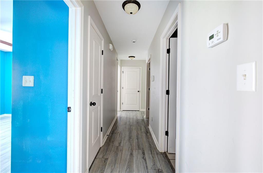 561 Holland Road Dallas, GA 30157 - Photo 19 of 48 a view of a hallway with wooden floor